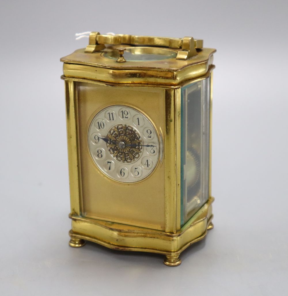 A brass cased carriage clock, height 14cm with handle down